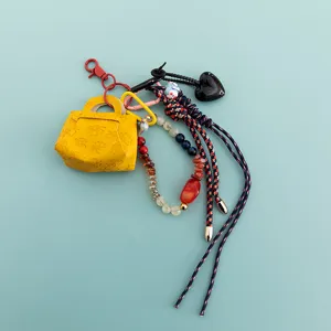 Borsa in pelle PU ciondolo perle cristallo corda intrecciata portachiavi chic