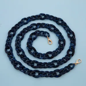Dark blue marble acrylic chain strap with gold lobster clasps for stylish bag and phone case.