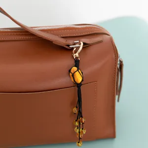 Handmade stone bag pendant braided net pocket keychain accessory for women handbag charm.