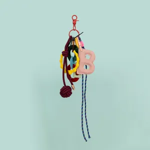 DIY bag charm keychain with pink letter B pendant bamboo rings and braided rope accessories