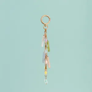Detailed view of colorful pastel resin bead keychain and bag charm with gold-tone hardware.