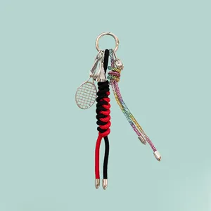 Alloy tennis badminton racket keychain bag charm with rhinestones and braided ropes.