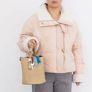 Khaki PU leather bucket bag with ruffled handle, cute key and star charms for daily use of women.
