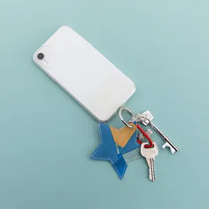 Hand-sewn five-pointed star PU leather keychain, stylish bag pendant and car key accessory.