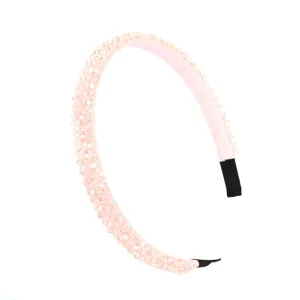 Detailed view of a light pink crystal rhinestone headband, shimmering beaded hair accessory for women.