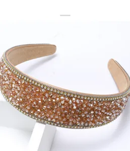 Detailed view of the elegant crystal rhinestone headband, sparkling champagne rhinestone design.