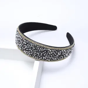 Elegant crystal rhinestone headband with shimmering stones and delicate claw chain edge for women.