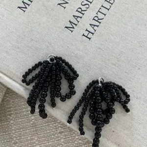 Black beaded bow shoe clip tassel accessory, stylish decorative charm for versatile footwear.