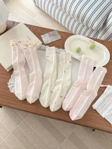 Sweet ruffled mesh mid-tube socks with cute floral print, breathable summer cotton hosiery.