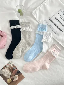 Sweet lace bow mesh mid-tube socks detail view, soft breathable summer hosiery style.