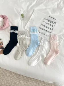 Sweet JK lace mesh mid-tube socks with cute bows, soft breathable summer hosiery style.