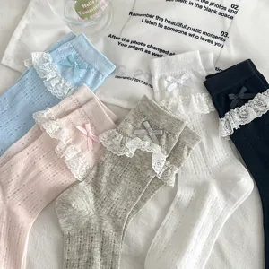 Sweet JK style lace ruffle mid-calf mesh socks with cute bowknot for women summer wear.