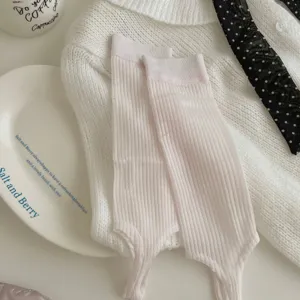 Detail view of Korean style pink stirrup socks, summer thin ribbed leg warmers for women.