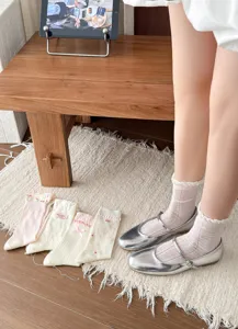 Detailed view of sweet Korean style summer mesh mid-calf socks with delicate lace and cute bows.