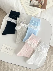 Sweet JK lace mesh mid-tube socks with cute bows for summer, soft breathable daily wear.