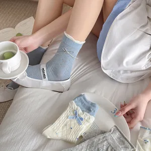 Cute bow mid-calf socks for women, sweet floral and striped knit design, cozy daily wear.
