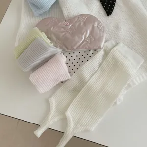 Ribbed knit stirrup leg warmers detail shot, soft ballet core style socks for daily wear.