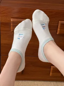Detail shot of women's breathable thin low-cut cotton socks with cute bow embroidery.
