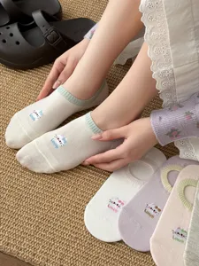 Detailed view of Japanese style breathable mesh low cut socks with cute cat embroidery pattern.