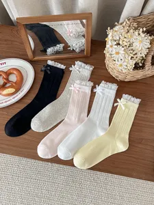 Sweet lace bow mid-tube socks for women, breathable mesh spring summer cute daily wear.