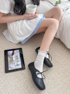 White lace bow mesh mid-tube socks detail shot, sweet style breathable spring summer wear.
