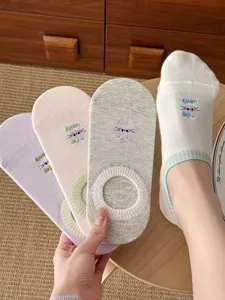 Close-up detail of women breathable summer low-cut socks with cute embroidery and bow design.