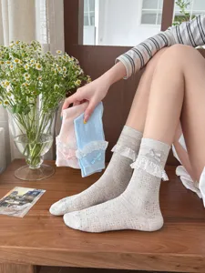 Sweet JK lace bow mid-calf socks for women, cute mesh breathable summer hosiery options.