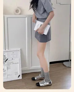 Grey polka dot mid-calf socks detail shot, soft fabric and stylish daily wear styling.