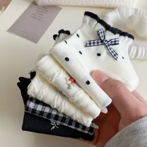Cute Japanese style women's short socks set with bow, polka dots, floral embroidery, and plaid.
