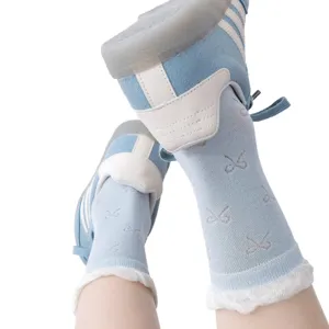 Sweet light blue mid-calf socks for women featuring cute bow patterns and ruffled cuffs, sweet.