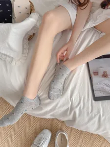 Grey floral boat socks detail showing the soft cotton material and cute pattern design.