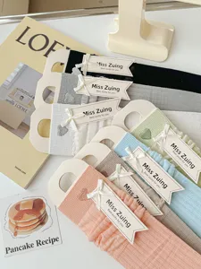 Close-up details of cute mesh ruffle crew socks with heart embroidery in sweet pastel colors.