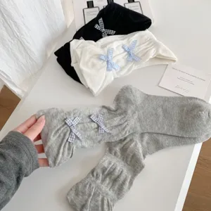 Sweet bow mid-tube stack socks for women, cute summer thin lolita style knit hosiery detail.