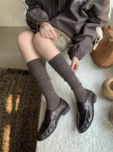 Cozy winter thick knit knee-high slouch socks for women, stylish diamond hollow brown calf hosiery.