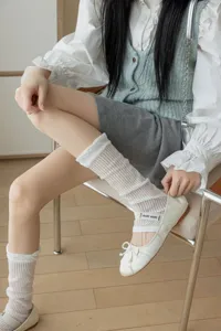 Detail shot of sheer stacked women socks paired with sweet ballet flats, soft breathable fabric.