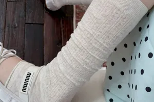 Women grey cotton mesh leg warmers ballet style long stacking socks closeup detail view.