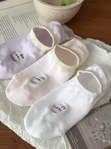Close-up of summer thin women's low-cut socks with cute cat embroidery and bow design.