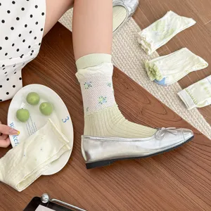 Green floral mid-calf socks for women, sweet pastoral style, comfortable autumn wear detail.