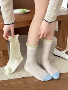 Cozy cotton mid-calf socks with cute ruffles and contrast toes, perfect for autumn.