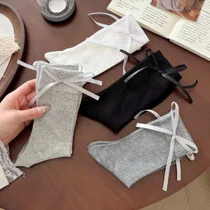 Ribbed mid-calf socks for women with sweet ribbon bows, cute white black grey cotton daily wear.
