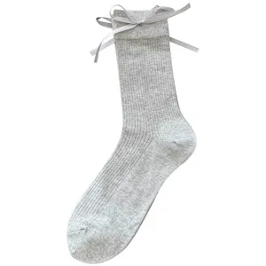 Ribbed grey mid-calf socks featuring a sweet ribbon bow detail, perfect for sweet Japanese style.
