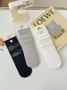 Detail view of sheer mesh stack socks featuring sweet heart embroidery in lovely ins style.