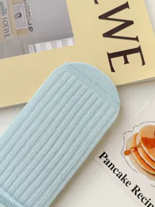 Light blue ribbed knit mid-calf socks detail, breathable daily wear sock close-up view