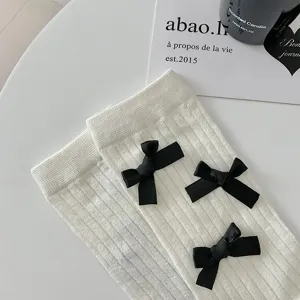 Summer sweet white mid-calf socks featuring elegant black bow accents chic casual daily footwear