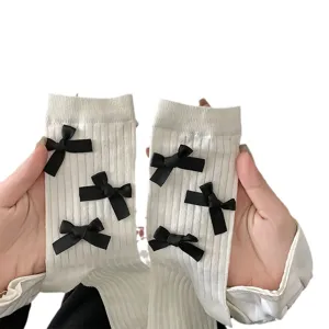 Sweet bow mid-tube thin socks for women, fashionable solid color cute style for daily wear.