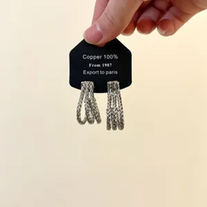 Cross-border fashion metal multi-strand braided J-shaped hoop earrings, stylish silver ear jewelry.