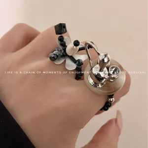 Y2K beaded flower teapot ring, edgy stackable elastic cord finger ring for women fashion.