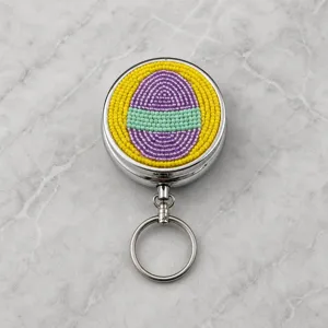 Osterperlen Metall Pillendose Schlüsselanhänger bunte Saatperlen Ei Design tragbar.