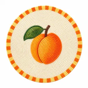 Handmade beaded peach fruit coaster detail view, exquisite woven heat insulation mat for table.