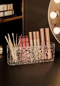 Clear acrylic 4-grid makeup organizer with water ripple texture for cosmetic brushes and lipsticks.